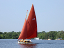 Another boat sailing on Wroxham Broad