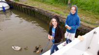 Joely and Nina feeding the ducks at St Olaves