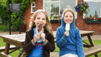 Girls having lollies at the Bridge Inn, Acle